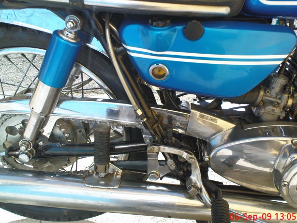 Brake cable goes under the seat.